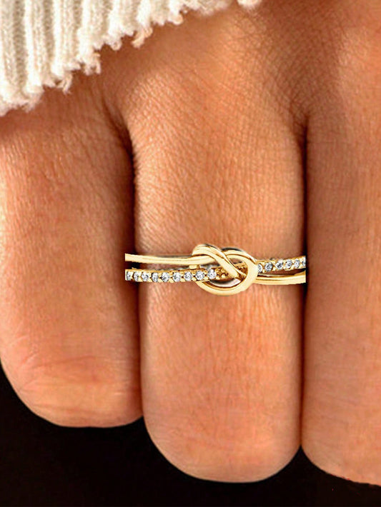 Anillo Vintage de Plata S925 con un Elegante Diseño de Doble Nudo en Tono Rosa